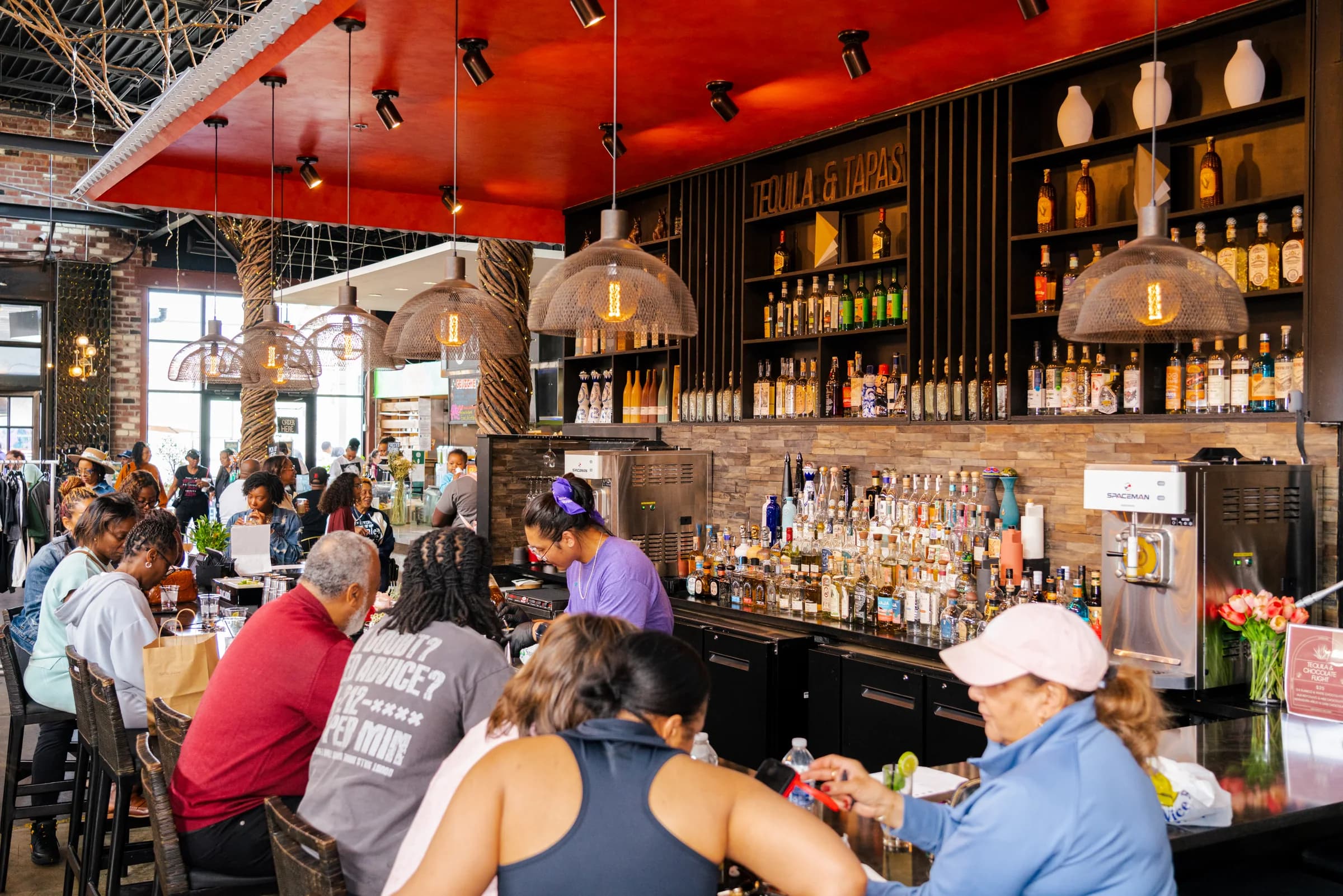 The Chattahoochee Food Works communal bar filled with guests